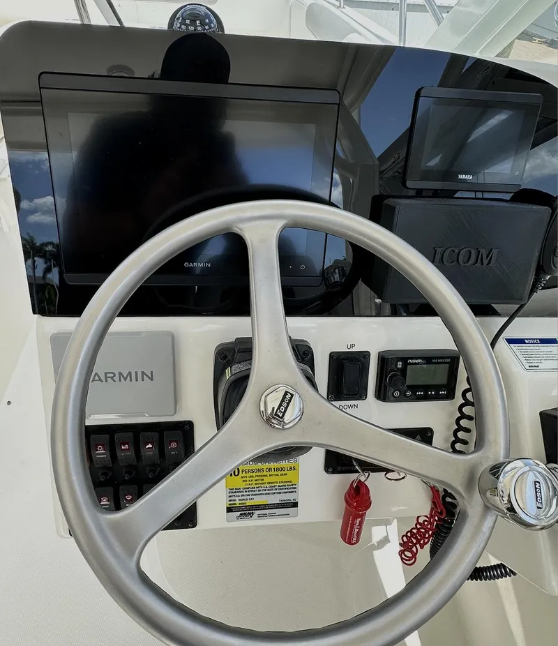 Slide: The Image of 2021 World Cat 255 DC helm with Garmin and Icom electronics. - 29