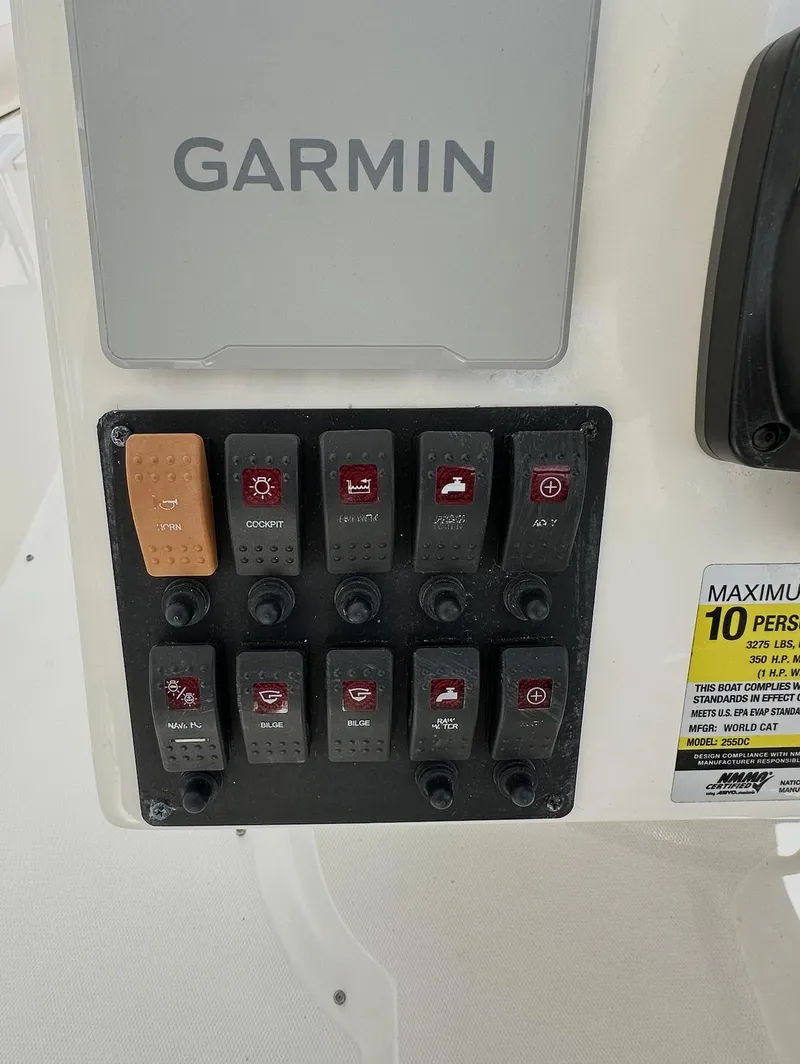 Slide: The Image of Control panel of a 2021 World Cat 255 DC boat with Garmin display. - 32