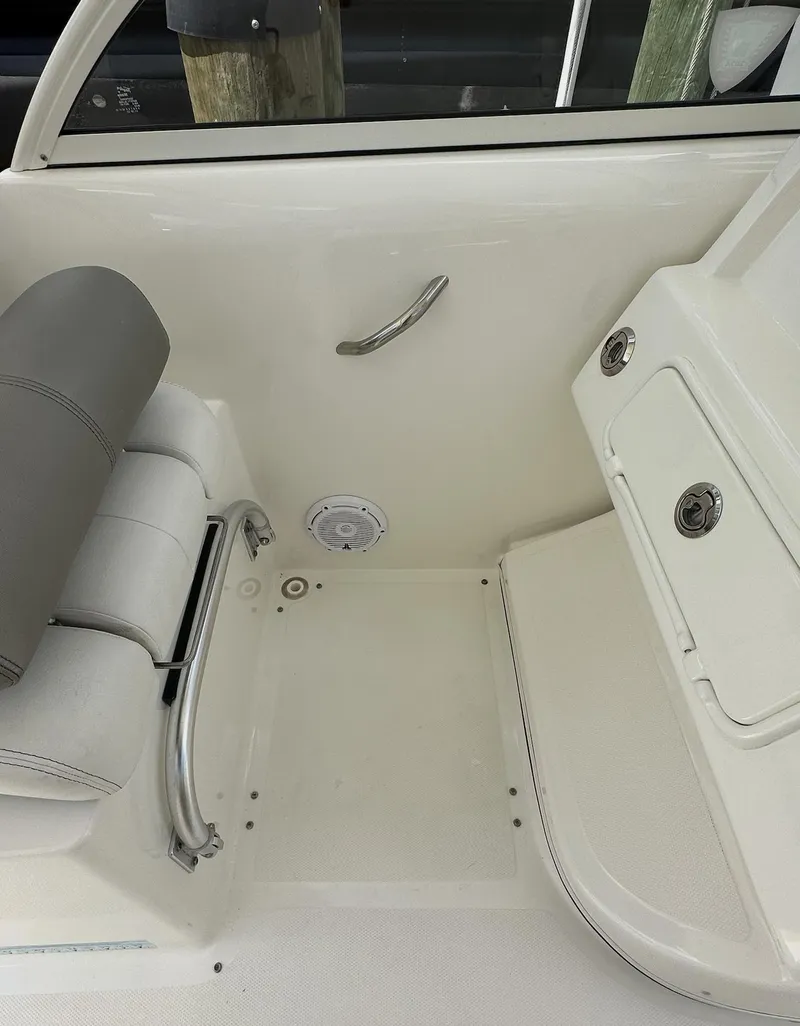 Slide: The Image of 2021 World Cat 255 DC boat interior with seating and storage compartments. - 35