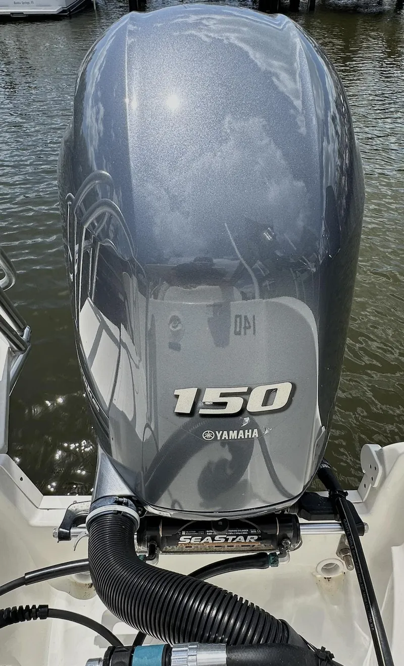 Slide: The Image of Yamaha 150 outboard motor on 2021 World Cat 255 DC boat, docked on water. - 39