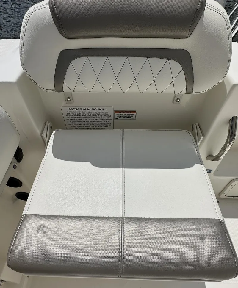 Slide: The Image of 2021 World Cat 255 DC boat seat with gray and white upholstery. - 46