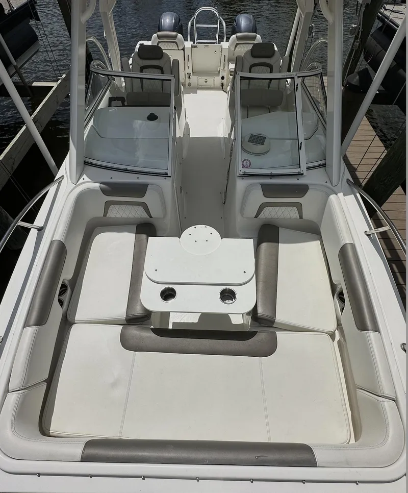Slide: The Image of 2021 World Cat 255 DC boat interior with spacious seating and dual consoles. - 48