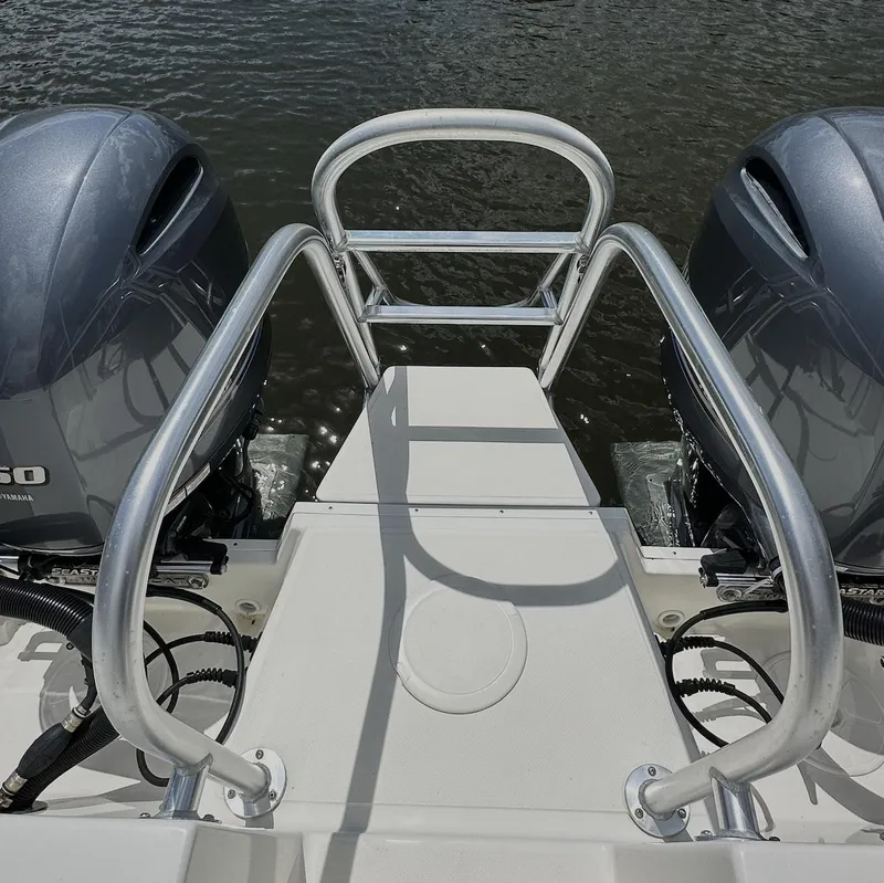Slide: The Image of 2021 World Cat 255 DC boat with dual engines and rear access ladder. - 49