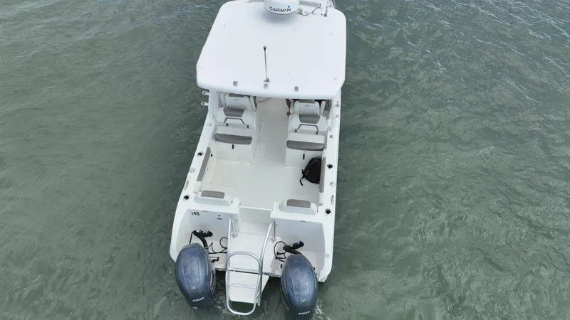 Slide: The Image of 2021 World Cat 255 DC boat on water, aerial view, dual engines visible. - 6