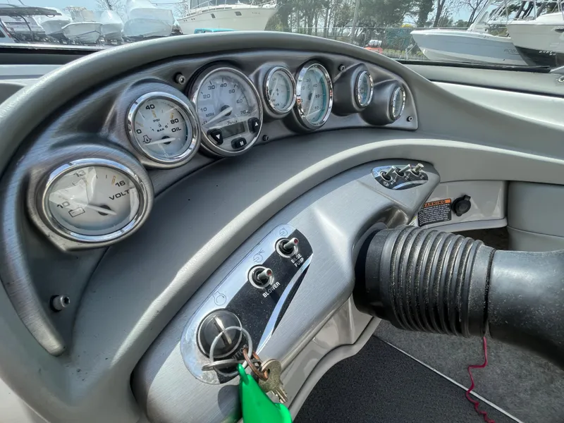 Slide: The Image of Dashboard of a 2011 Bayliner 195 boat with gauges and controls. - 21
