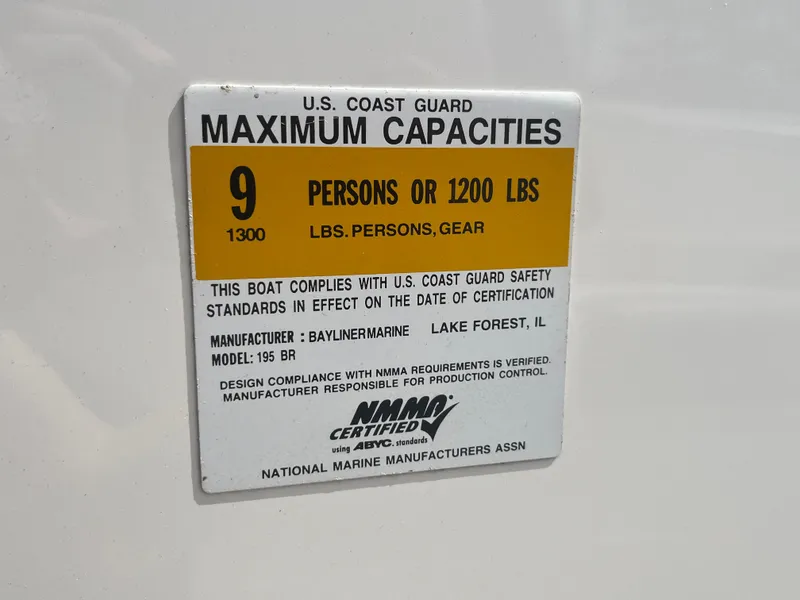 Slide: The Image of U.S. Coast Guard capacity label for 2011 Bayliner 195, maximum 9 persons or 1200 lbs. - 26