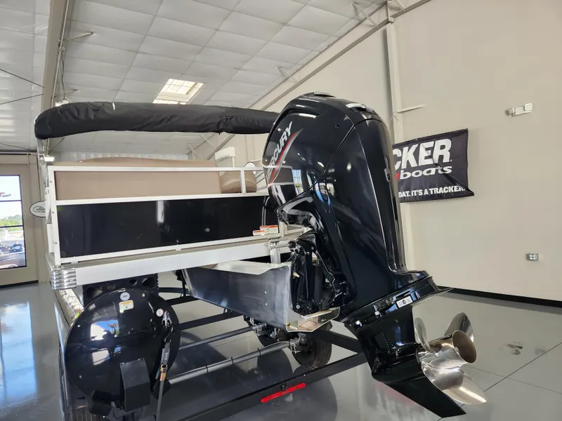 Slide: The Image of 2025 Ranger 200C boat with Mercury outboard motor in showroom. - 3