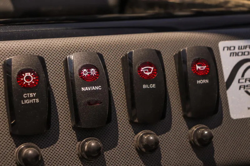 Slide: The Image of Control panel of 2025 Yamaha AR195 boat with labeled switches for lights, navigation, bilge, and horn. - 12