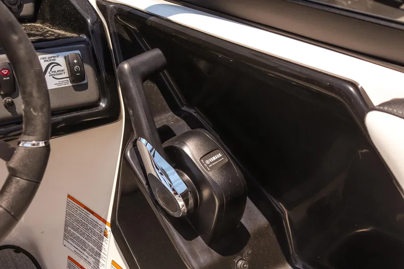 Slide: The Image of 2025 Yamaha Boats AR195 throttle control and dashboard detail. - 13