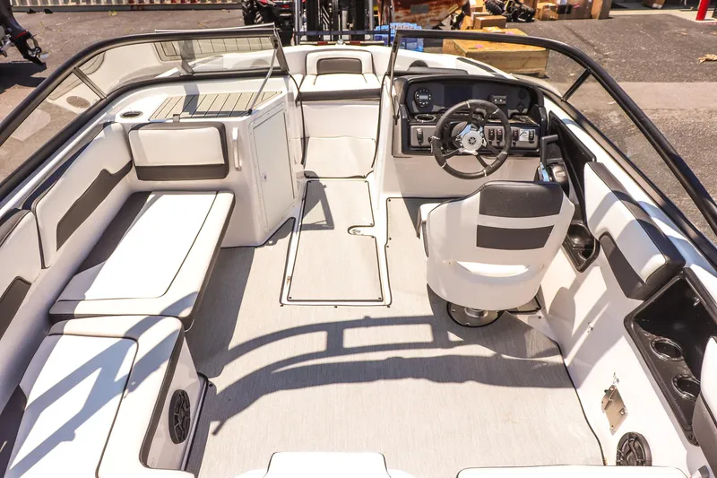 Slide: The Image of 2025 Yamaha Boats AR195 interior with sleek seating and modern dashboard design. - 14