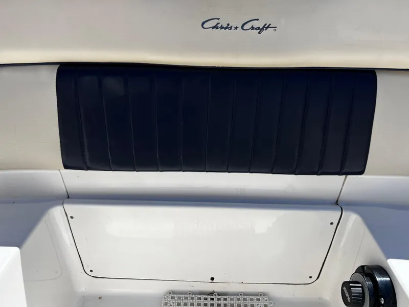 Slide: The Image of 2004 Chris-Craft Corsair 25 boat interior with logo and seating detail. - 15