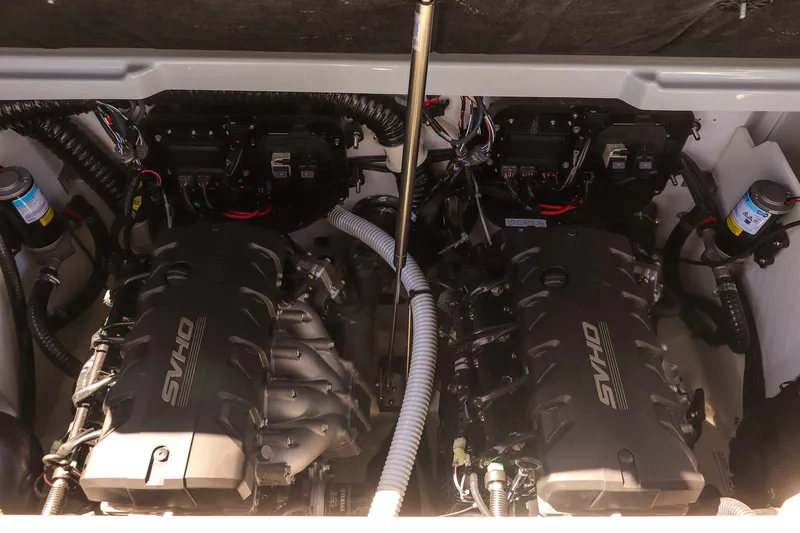 Slide: The Image of 2025 Yamaha Boats 255XD engine compartment with dual SVHO engines. - 21