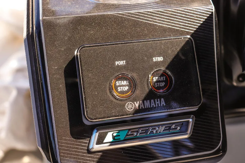 Slide: The Image of Control panel of 2025 Yamaha Boats 255XD, featuring start/stop buttons for port and starboard. - 22