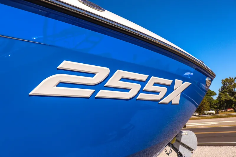 Slide: The Image of Blue 2025 Yamaha Boats 255XD with bold "255X" lettering on the side. - 9