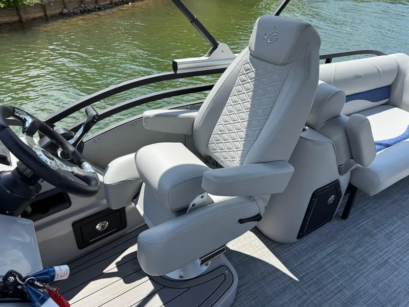 Slide: The Image of Captain's chair on 2025 JC Neptoon Sport 23TT DSL pontoon boat, featuring luxurious design. - 15