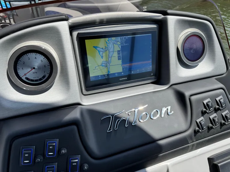 Slide: The Image of Dashboard of 2025 JC Neptoon Sport 23TT DSL with navigation display and controls. - 17