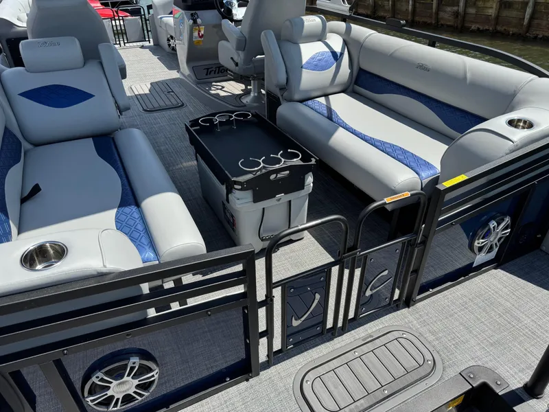 Slide: The Image of 2025 JC Neptoon Sport 23TT DSL pontoon boat interior with plush seating and cup holders. - 26