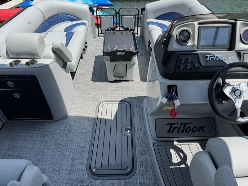 Slide: The Image of 2025 JC Neptoon Sport 23TT DSL pontoon boat interior with modern seating and control panel. - 3