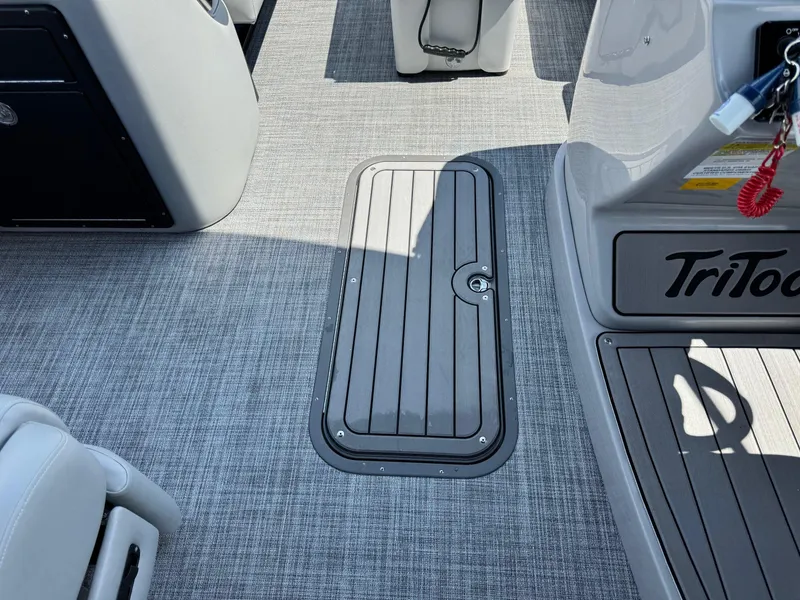 Slide: The Image of 2025 JC Neptoon Sport 23TT DSL boat interior with sleek flooring and storage compartment. - 8