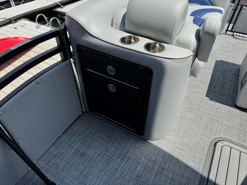 Slide: The Image of 2025 JC Neptoon Sport 23TT DSL boat interior with cup holders and storage. - 9