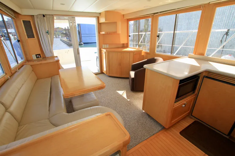 Slide: The Image of Interior of 1999 McKinna 47 Sedan yacht with spacious seating and modern amenities. - 31