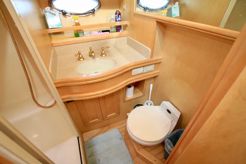Slide: The Image of Bathroom interior of 1999 McKinna 47 Sedan yacht with sink and toilet. - 34