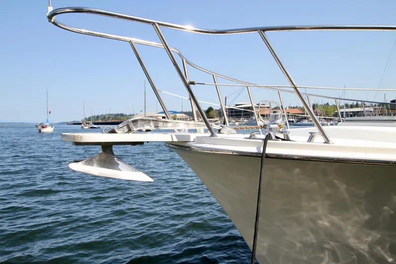 Slide: The Image of 1999 McKinna 47 Sedan yacht on calm water with clear blue sky. - 4