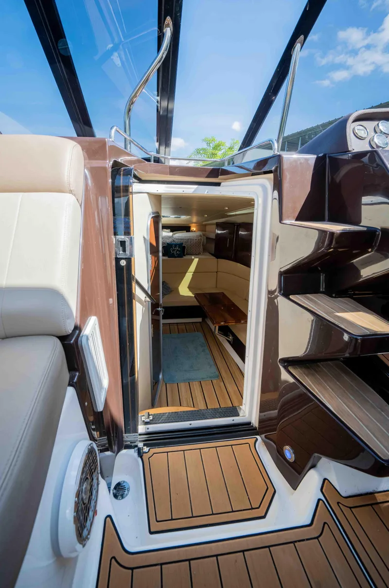Slide: The Image of 2015 Regal 35 Sport Coupe interior with teak flooring and modern design. - 16