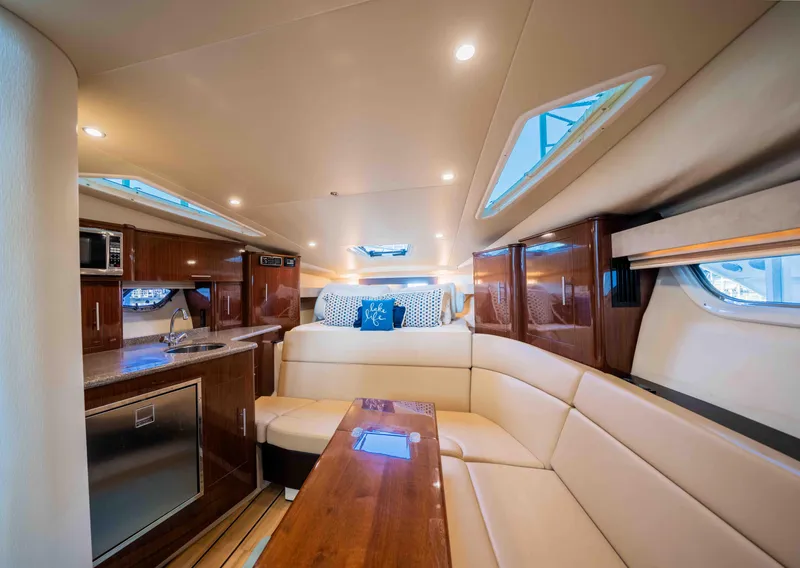 Slide: The Image of Luxurious interior of 2015 Regal 35 Sport Coupe yacht with modern amenities and elegant design. - 22