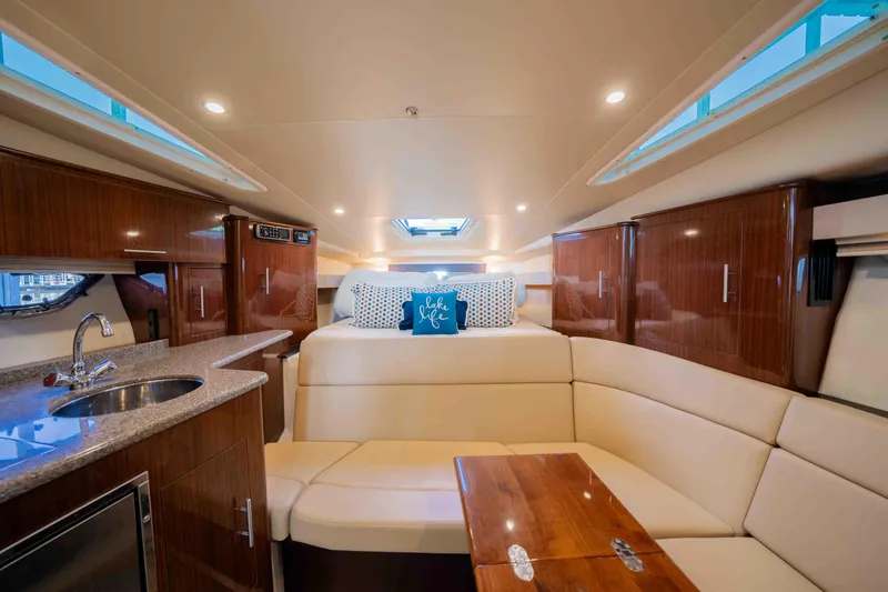 Slide: The Image of Luxurious interior of 2015 Regal 35 Sport Coupe yacht with cozy seating and modern amenities. - 24