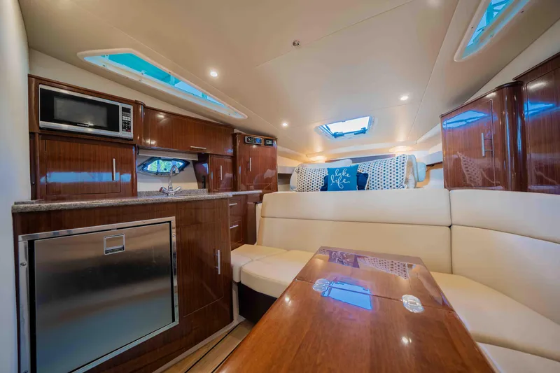 Slide: The Image of Luxurious interior of a 2015 Regal 35 Sport Coupe yacht with modern amenities. - 26