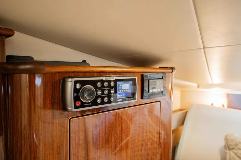 Slide: The Image of 2015 Regal 35 Sport Coupe interior with wood finish and audio system. - 33