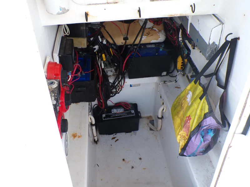Slide: The Image of Interior view of a 2002 Contender 31 Center Console boat's storage compartment. - 12