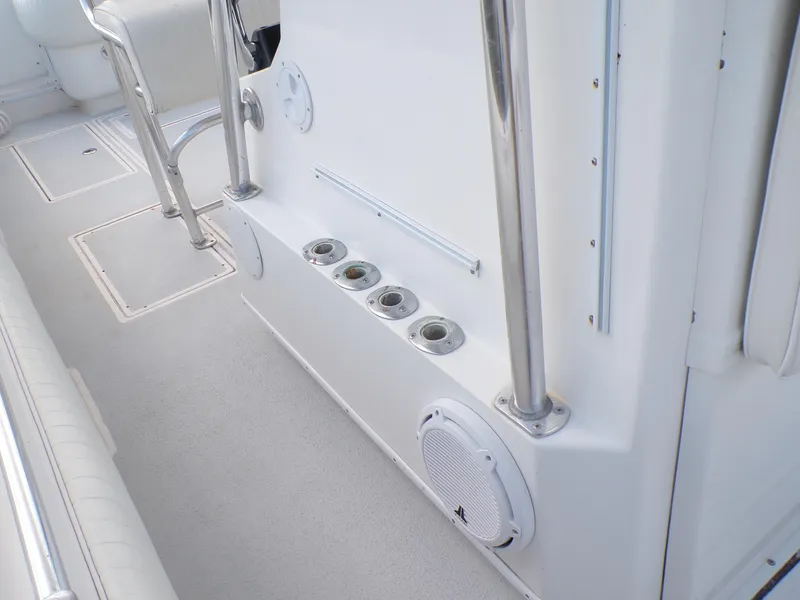 Slide: The Image of 2002 Contender 31 Center Console interior with rod holders and speaker. - 14