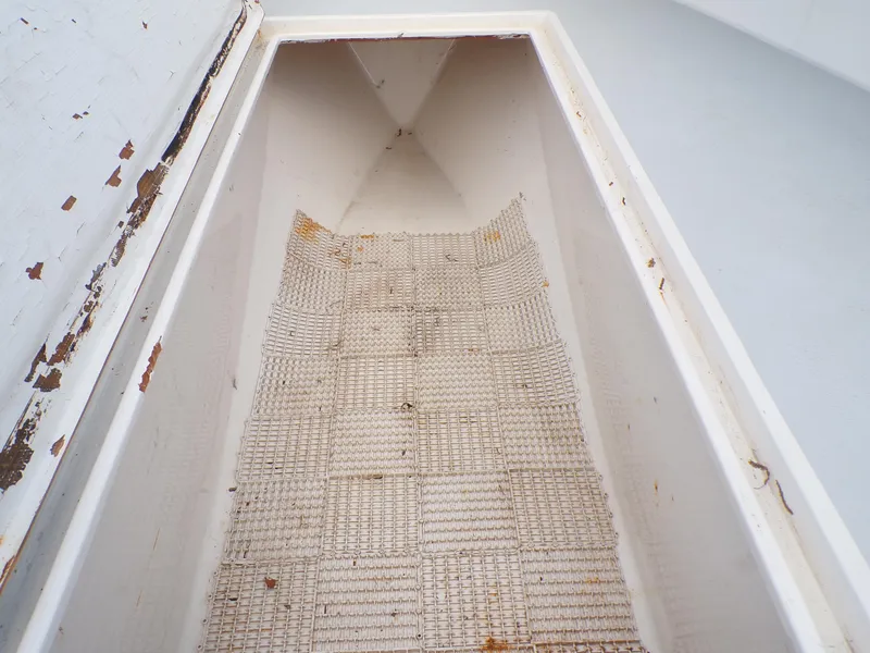 Slide: The Image of Storage compartment of a 2002 Contender 31 Center Console boat, showing interior details. - 17