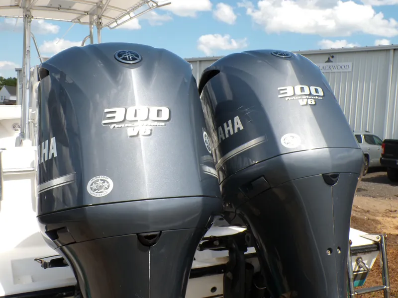 Slide: The Image of Twin Yamaha 300 V6 outboard engines on a 2002 Contender 31 Center Console boat. - 4