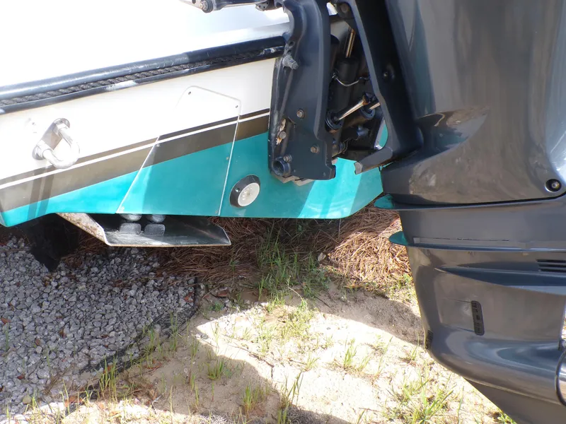 Slide: The Image of 2002 Contender 31 Center Console boat with visible outboard motor and hull details. - 5