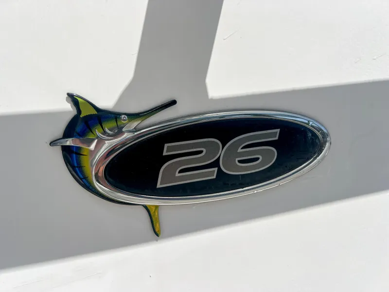 Slide: The Image of 2006 Regulator 26 FS logo with marlin design on white background. - 13