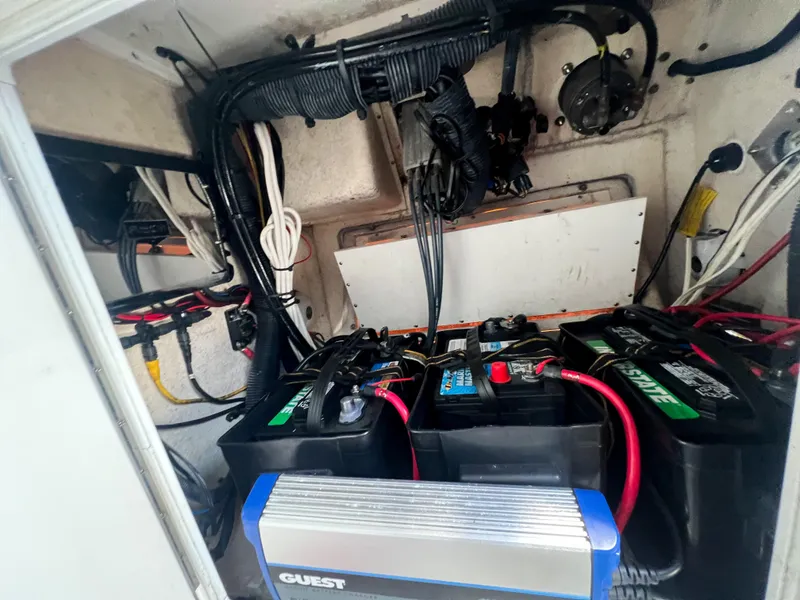 Slide: The Image of Electrical system of a 2006 Regulator 26 FS boat with batteries and wiring. - 28