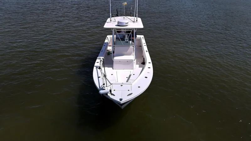 Slide: The Image of 2006 Regulator 26 FS boat on calm water, aerial view. - 7