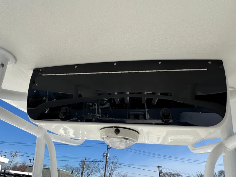 Slide: The Image of Tidewater 230 boat console with black panel and light, 2011 model. - 13