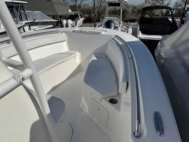 Slide: The Image of 2011 Tidewater 230 boat interior with white seating and sleek design. - 14