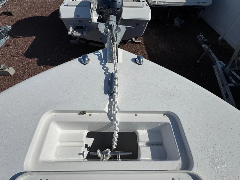 Slide: The Image of Bow of 2011 Tidewater 230 boat with anchor chain and storage compartment. - 17