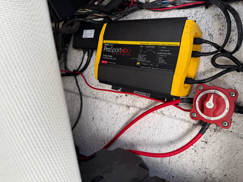 Slide: The Image of Battery charger and wiring inside a 2011 Tidewater 230 boat. - 22