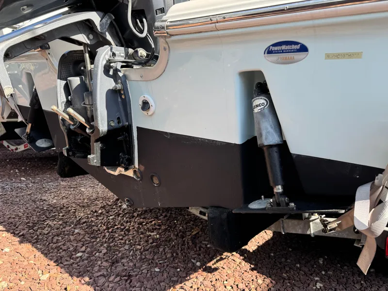 Slide: The Image of Rear view of a 2011 Tidewater 230 boat, showcasing the engine and trim tabs. - 3