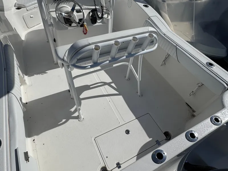 Slide: The Image of 2011 Tidewater 230 boat interior with rod holders and steering console. - 4