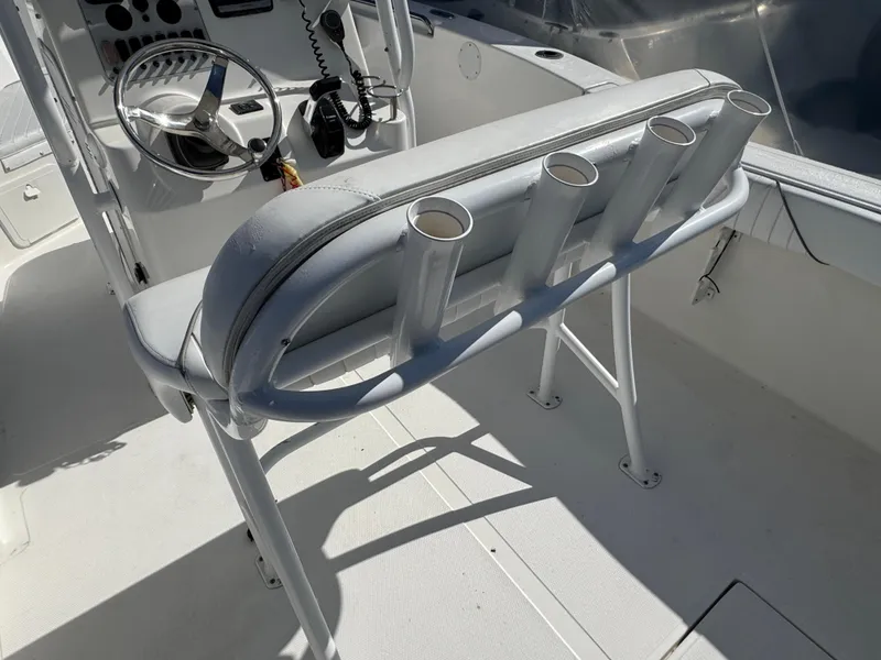 Slide: The Image of 2011 Tidewater 230 boat interior with rod holders and steering console. - 6