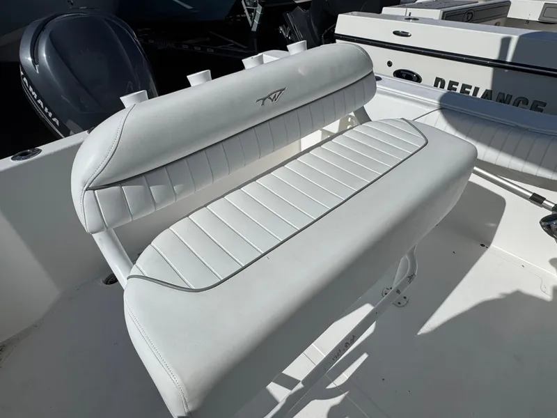 Slide: The Image of White leather seating on a 2011 Tidewater 230 boat, featuring sleek design and comfortable padding. - 8