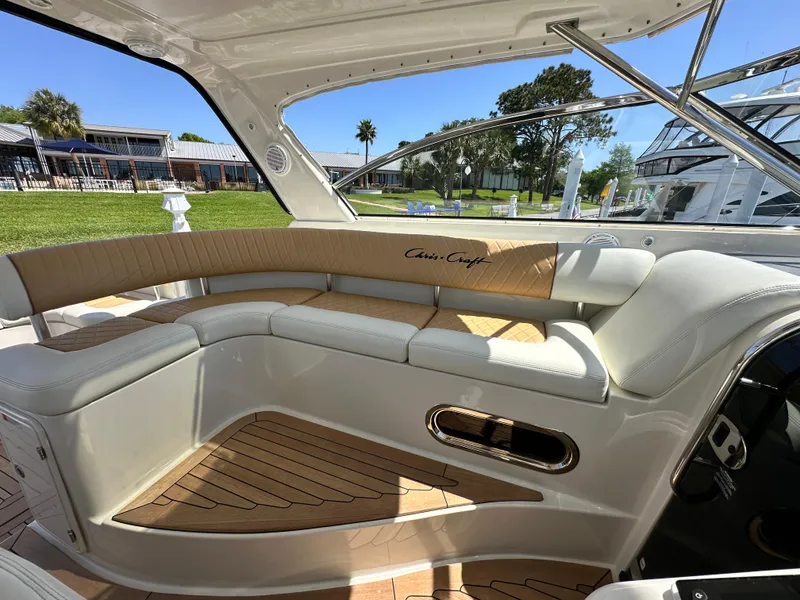 Slide: The Image of Luxurious 2007 Chris-Craft Roamer 40 yacht interior with elegant seating and wood accents. - 12