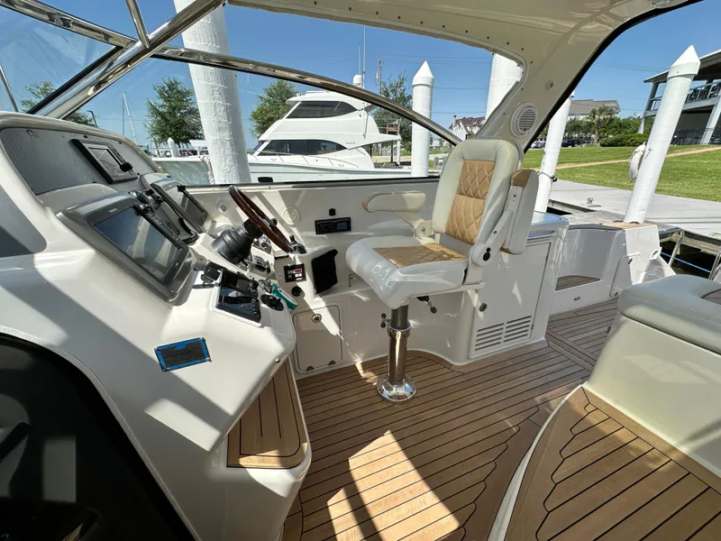 Slide: The Image of 2007 Chris-Craft Roamer 40 cockpit with modern controls and luxurious seating. - 14
